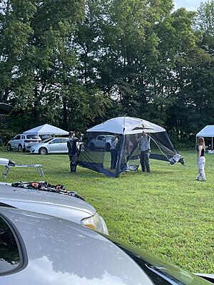 The Expandables braintrust. How many people does it take to raise a canopy?