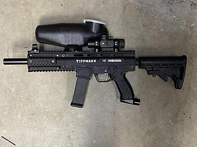 Tippmann X7 Phenom with offset hopper, adjustable stock and red dot sight.