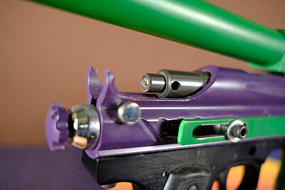 The slot in the pump rod to allow hammer movement.