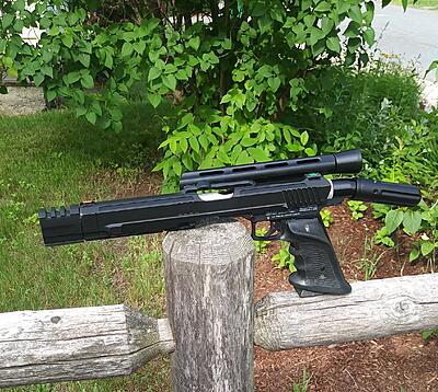 This is Obsidian...specs are as follows

ACI Hornet/Trracer Tagmaster base
Armson Stealth barrel turned down and cut for slide
One of a kind Duck style Reconslide
Mongo one piece feed
Volquartersen Target grips
Carter bucket changer