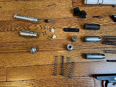 Front end LP chambers, valve springs from a spring kit, cup seals, and valves. I'm not sure what is up with that brass valve. It might not even belong to a Spyder.